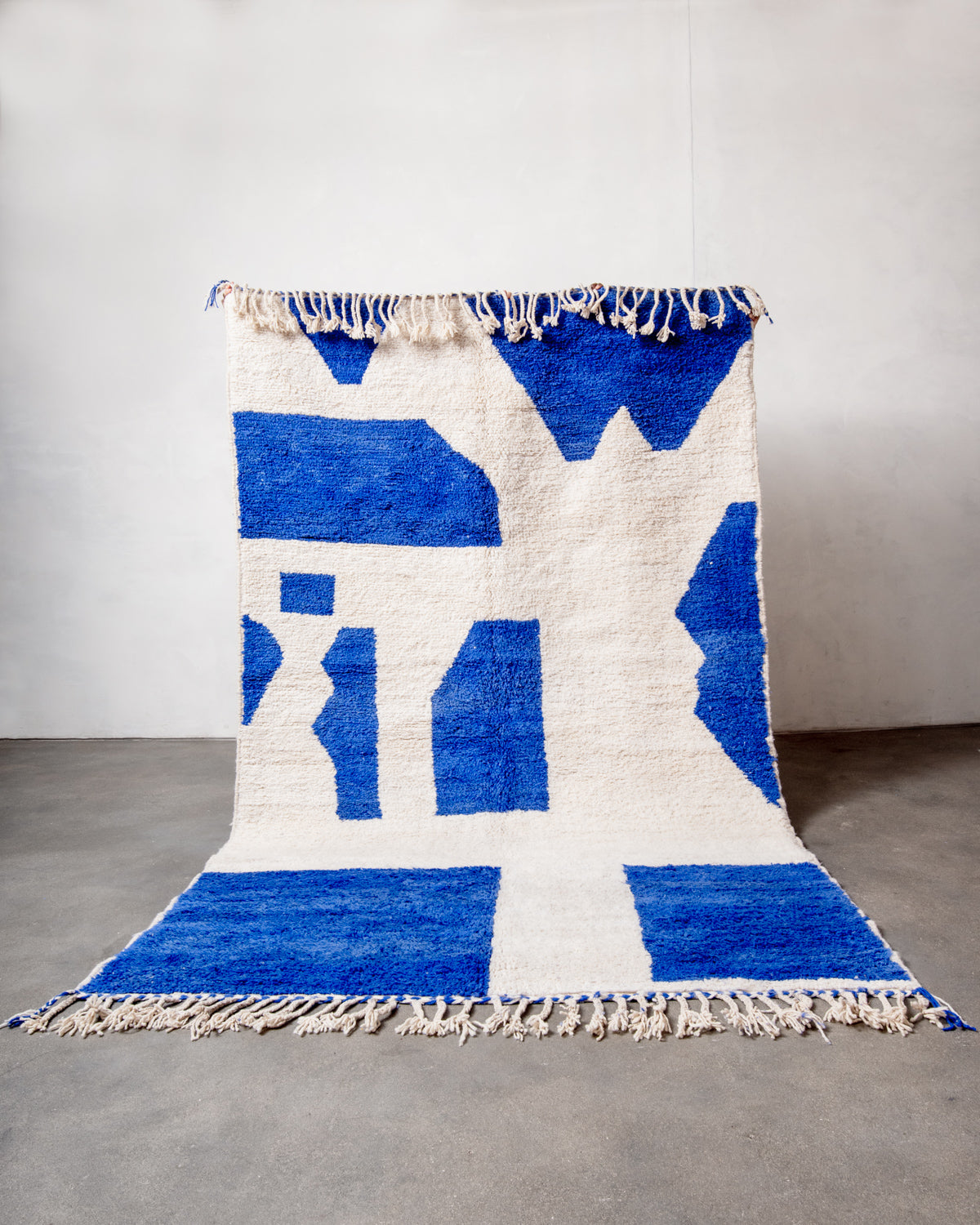Modern, designer, handcrafted Berber rug from Morocco. Beniourain carpet with beautiful colours and patterns and fluffy wool texture.
